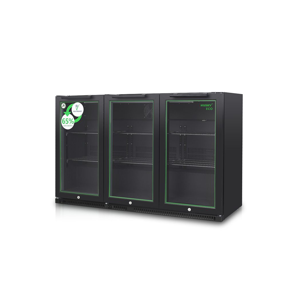 A three-door black commercial refrigerator with sleek, glass-front doors stands in a plain white setting. There's a sticker on the left reading, "65% less energy." The right side is labeled "HUSKY ECO."